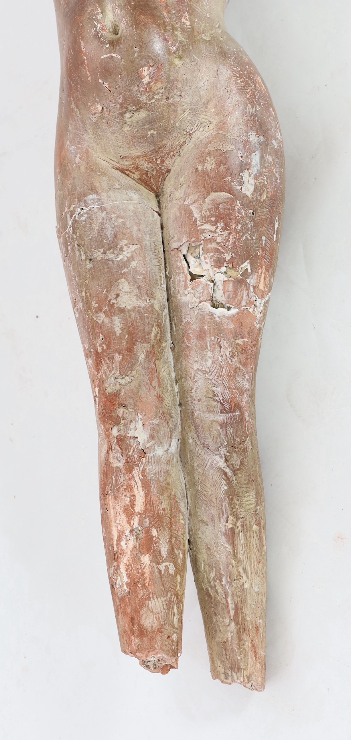 In the manner of Marino Marini, a terracotta sculpture, reclining female nude Length 120cm.